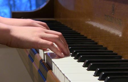 Student playing piano